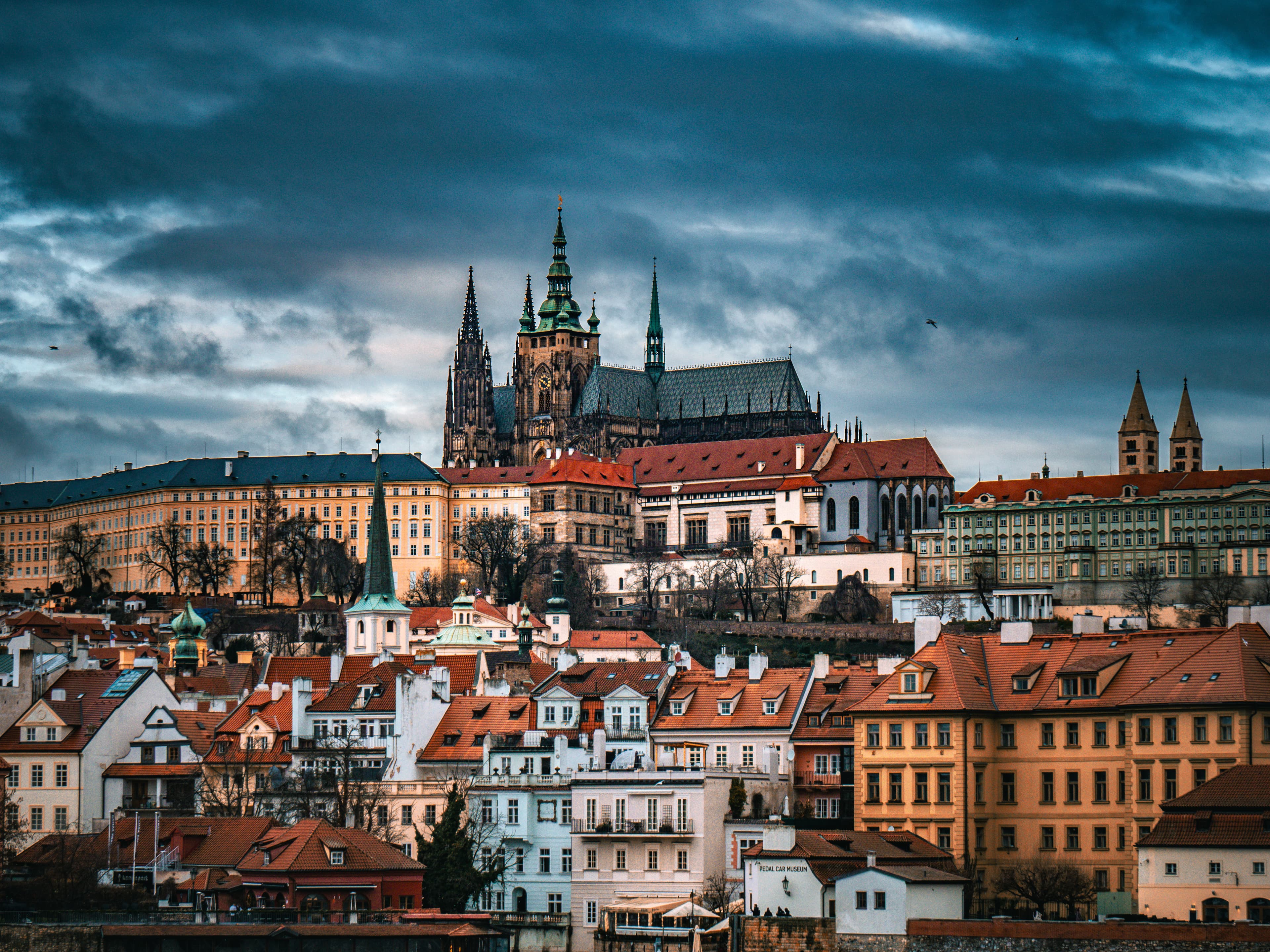 St Vitus Cathedral and Prague Castle beneath a dramatic storm sky